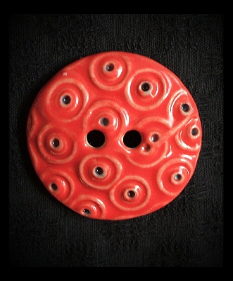 Handmade ceramic button: bright red.