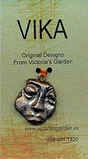 VIKA business card, ceramic pendant